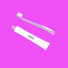 toothbrush and toothpaste on pink background