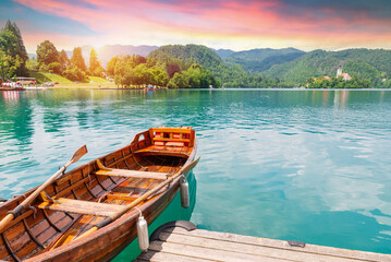 Sunrise view On Bled Lake, Island,Church And Castle With Mountain Range 