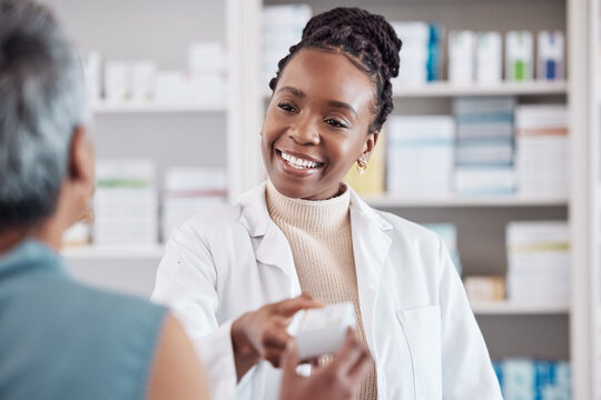 Pharmacist, Medicine Or Black Woman With Pills Supplements For Patient For Wellness Or Help. Pharmacy, Smile Or Doctor Giving A Mature Woman Medical Product Or Medication Box In Retail Healthcare