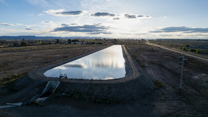Water reserve for agriculture in dry areas. Aerial photo at sunset.