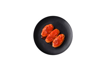 Meat cutlet or meatballs in tomato sauce with garlic, salt, spices and herbs