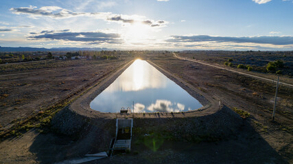 Water reserve for agriculture in dry areas. Aerial photo at sunset.