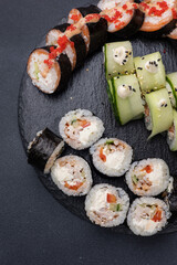 Delicious rolls on a dark background. Japanese cuisine. Close up  