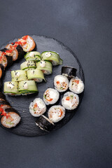 Delicious rolls on a dark background. Japanese cuisine. Close up  