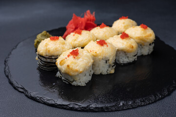 Delicious rolls on a dark background. Japanese cuisine. Close up  