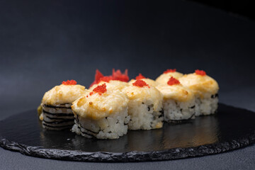 Delicious rolls on a dark background. Japanese cuisine. Close up  