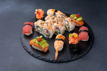 Delicious rolls on a dark background. Japanese cuisine. Close up  