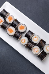Delicious rolls on a dark background. Japanese cuisine. Close up  