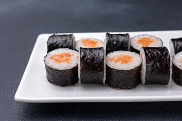 Delicious rolls on a dark background. Japanese cuisine. Close up  