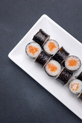 Delicious rolls on a dark background. Japanese cuisine. Close up  