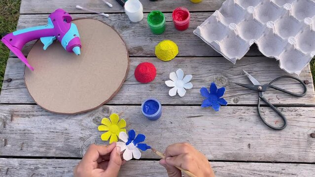 how to make flowers and lady bug from recycling egg boxes. Zero waste concept.