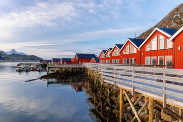 red houses on the shore of the sea at sunrise in leknes lofoten norway