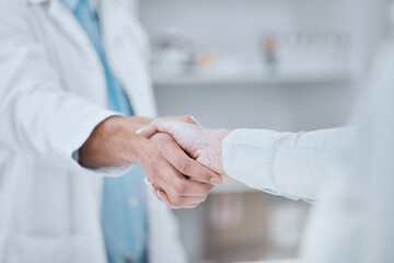 People, pharmacist and handshake in meeting, teamwork or agreement together for deal at pharmacy....