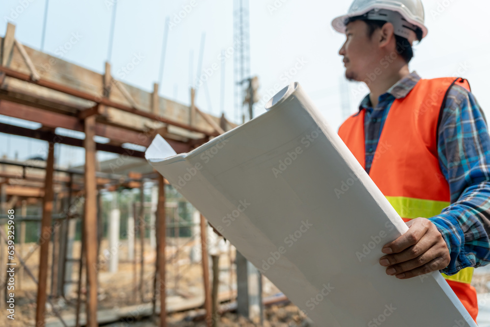 Wall mural inspector or engineer is inspecting construction and quality assurance new house using a blue print. Engineer or architects or contactor work to build the house before handing it over to the homeowner