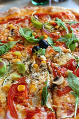 Vegetarian pizza with seasonal vegetable. Selective focus, close-up.