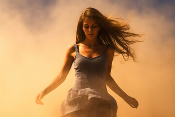 Attractive woman dancer in dust and fog