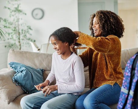 child mother family parent home woman teenage daughter hair comb backpack education preparation morning school bag back to school schoolgirl student happy