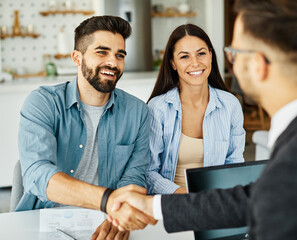young couple shaking hands deal contract real estate investment business agreement agent handshake...