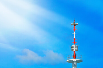 Obraz premium Announcement pole with horn speaker, broadcast tower and solar cell Morning clear sky background with bright sunlight.