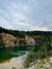 Fototapeta na wymiar Emerald lake with rocks around