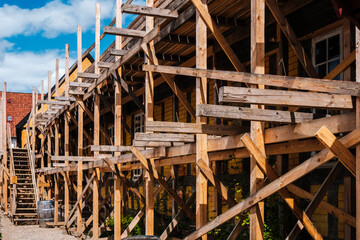 Handmade scaffolding with wooden beams and bars in a rural village.