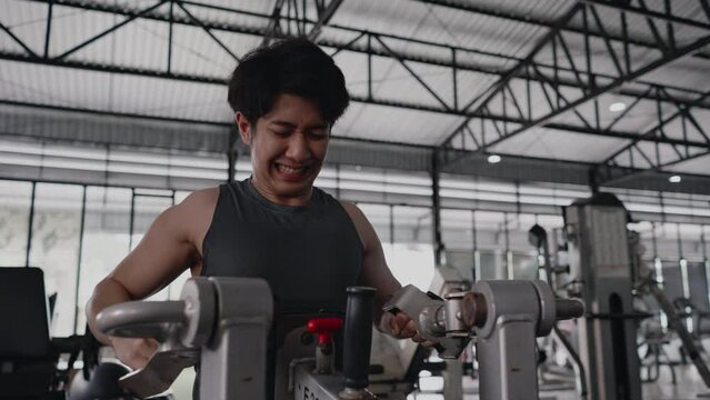 Pec Deck Fly Machine, Men exercise to increase chest muscles, Building Forearm Strength, Bodybuilders Intense Gym Workout with Weight Machine.