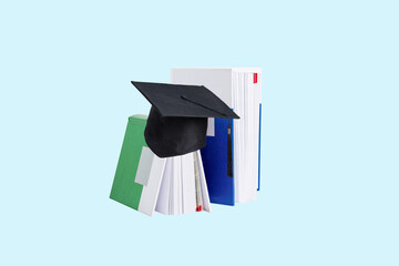 Books with square academic cap on blue blackboard. Education background. Back to school concept.