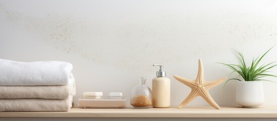 Fototapeta na wymiar Starfish themed bathroom set with dispenser and sponges displayed on a shelf