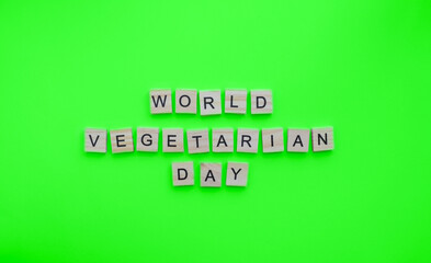 October 1, World Vegetarian Day, minimalistic banner with the inscription in wooden letters