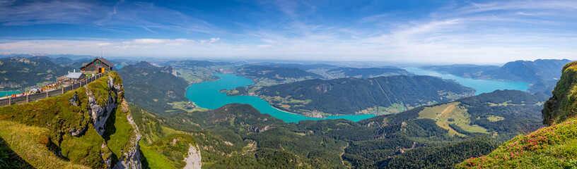 view from the top of Mount Schafberg over the landscape with mountains and Lake Mondsee and Lake...