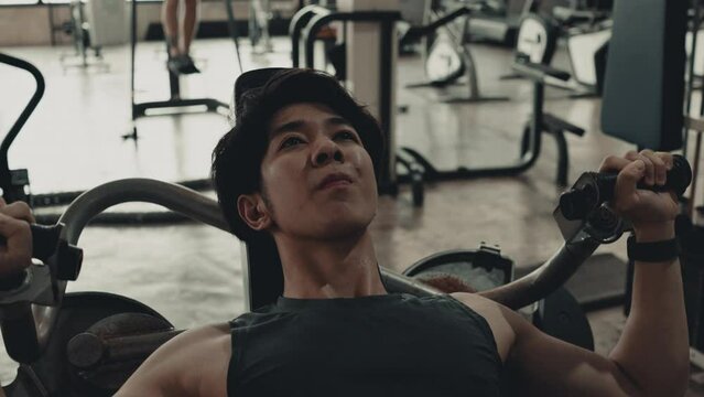Pec Deck Fly Machine, Muscular Man Sculpting Arm Strength with Gym Exercise Machine ,Fitness Enthusiast Working Out, Powerful Arm Muscle Strengthening in Gym Workout Session, Fitness.