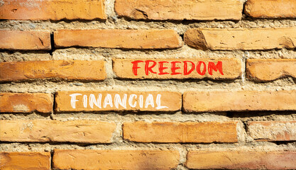 Financial freedom symbol. Concept words Financial freedom on beautiful brick wall. Beautiful red brown brick wall background. Business financial freedom concept. Copy space.