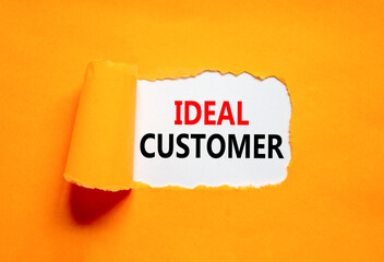 Ideal customer symbol. Concept words Ideal customer on beautiful white paper. Beautiful orange...