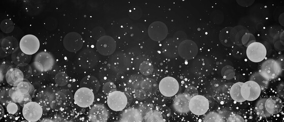 Abstract particles soft focus bokeh on dark background . Christmas background of shining dust Christmas glowing light bokeh
