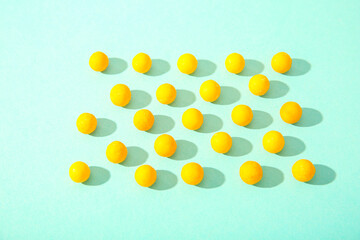 Yellow pills on blue background