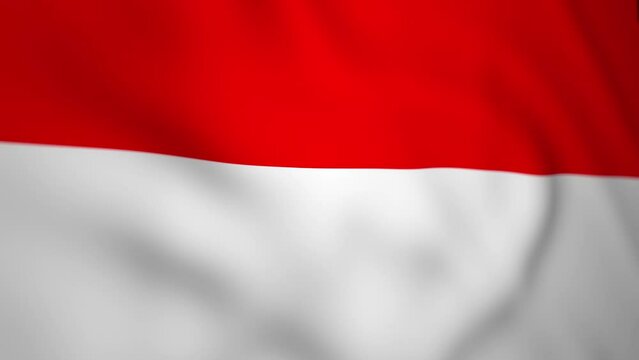 Wavy flag of Indonesia blowing in the wind in slow motion. Waving colorful symbol Indonesian flag abstract background