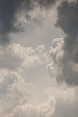 Fototapeta premium white storm clouds in sky background of nature. weather and climatic conditions, ecology. view of clouds from airplane window. Flight and freedom are religion. The top of sky and atmosphere, solar