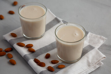 Organic White Almond Milk in Glasses, side view.