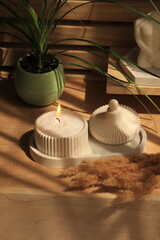 sand candle in plaster jar