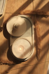 sand candle in plaster jar