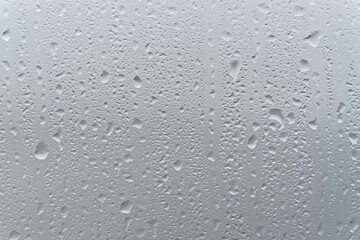 Water drops on a window glass - 639387381