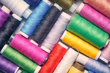 Set multicolored threads for cutting and sewing.