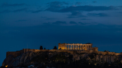 The Acropolis view with the Parthenon in Athens Greece in the evening. 

