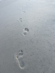 Fototapeta na wymiar Footprints on the Beach