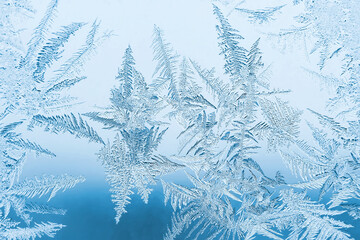 Abstract frosty pattern on glass, background texture - obrazy, fototapety, plakaty