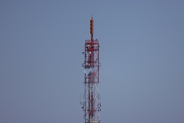 Part of a tall metal tower with transmitters