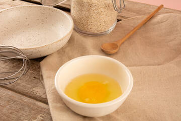 Egg yolk inside a white ceramic bowl