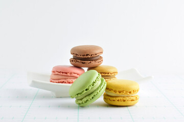 Typical French sweets, macarons, in different flavors.