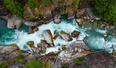 Fototapeten Schwarz River in a Rocky Mountain Canyon. British Columbia, Canada. Aerial Nature Background  © edb3_16