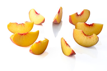 slices of fresh appetizing peach on a white background, studio shooting 1